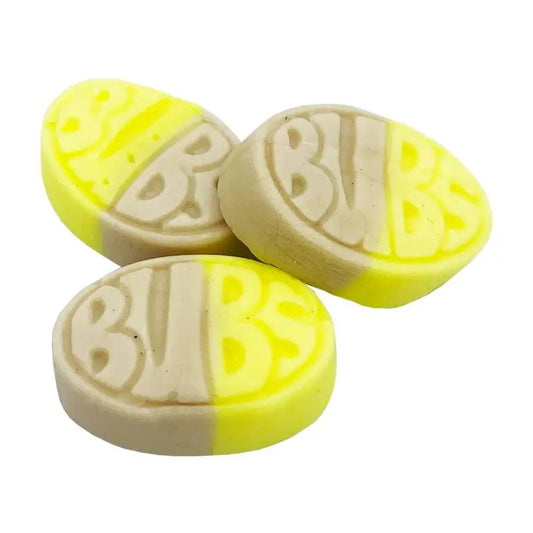 Yellow and caramel-coloured soft chewy sweets with glossy finish