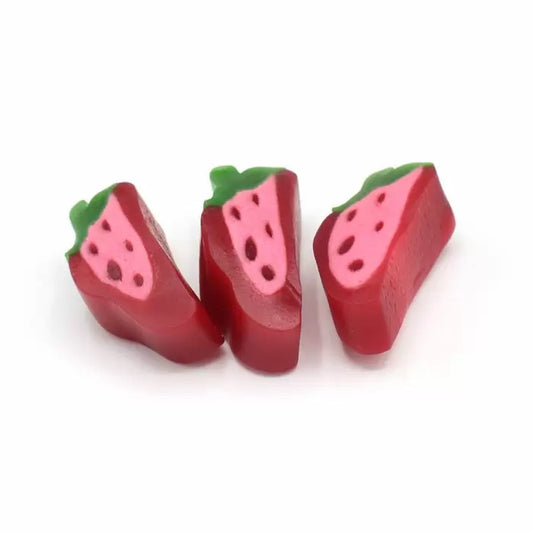 Chewy strawberry slice shaped sweets with vibrant red colour